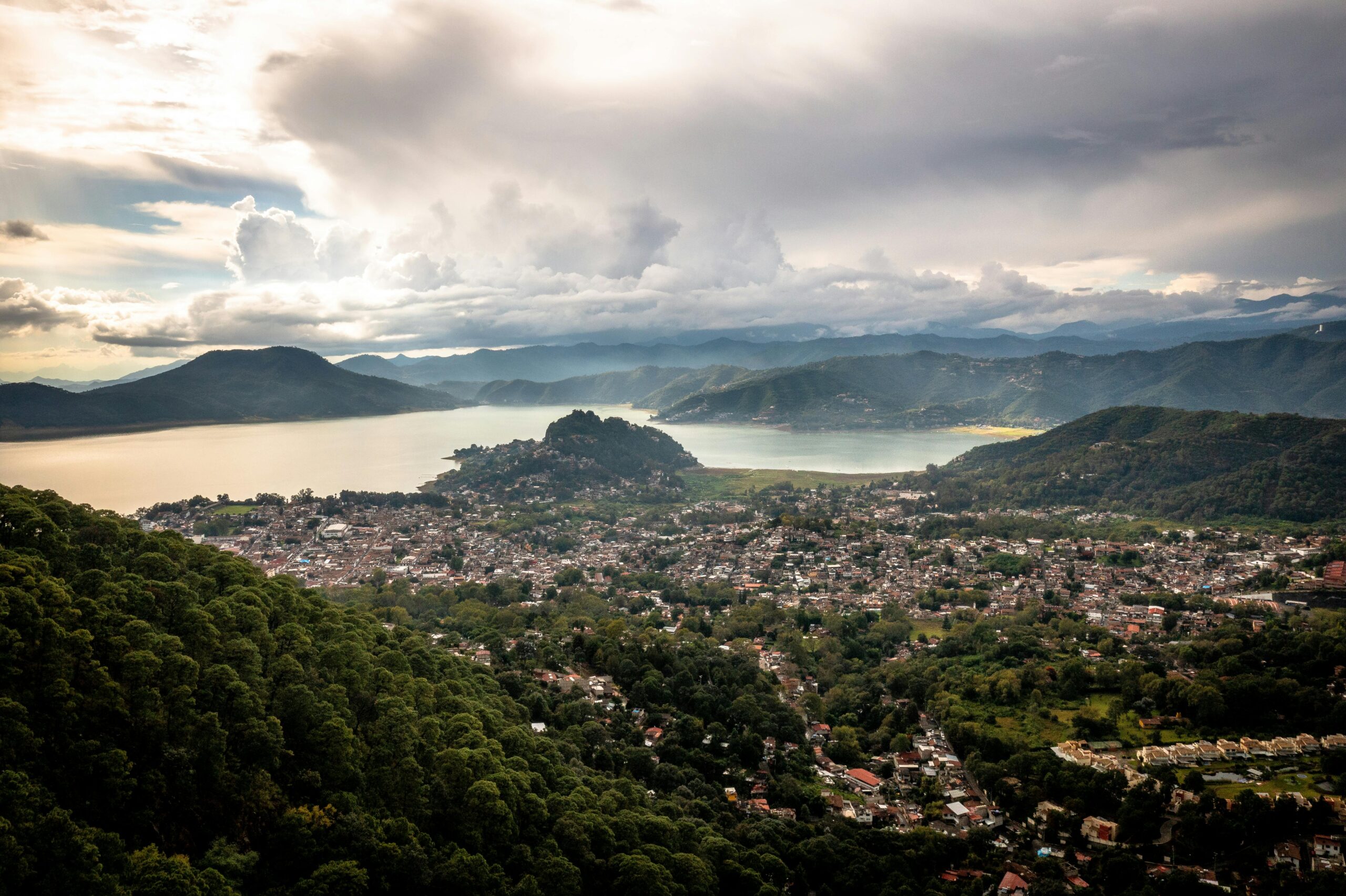 Discover Valle de Bravo's stunning landscape from above, bathed in afternoon light.